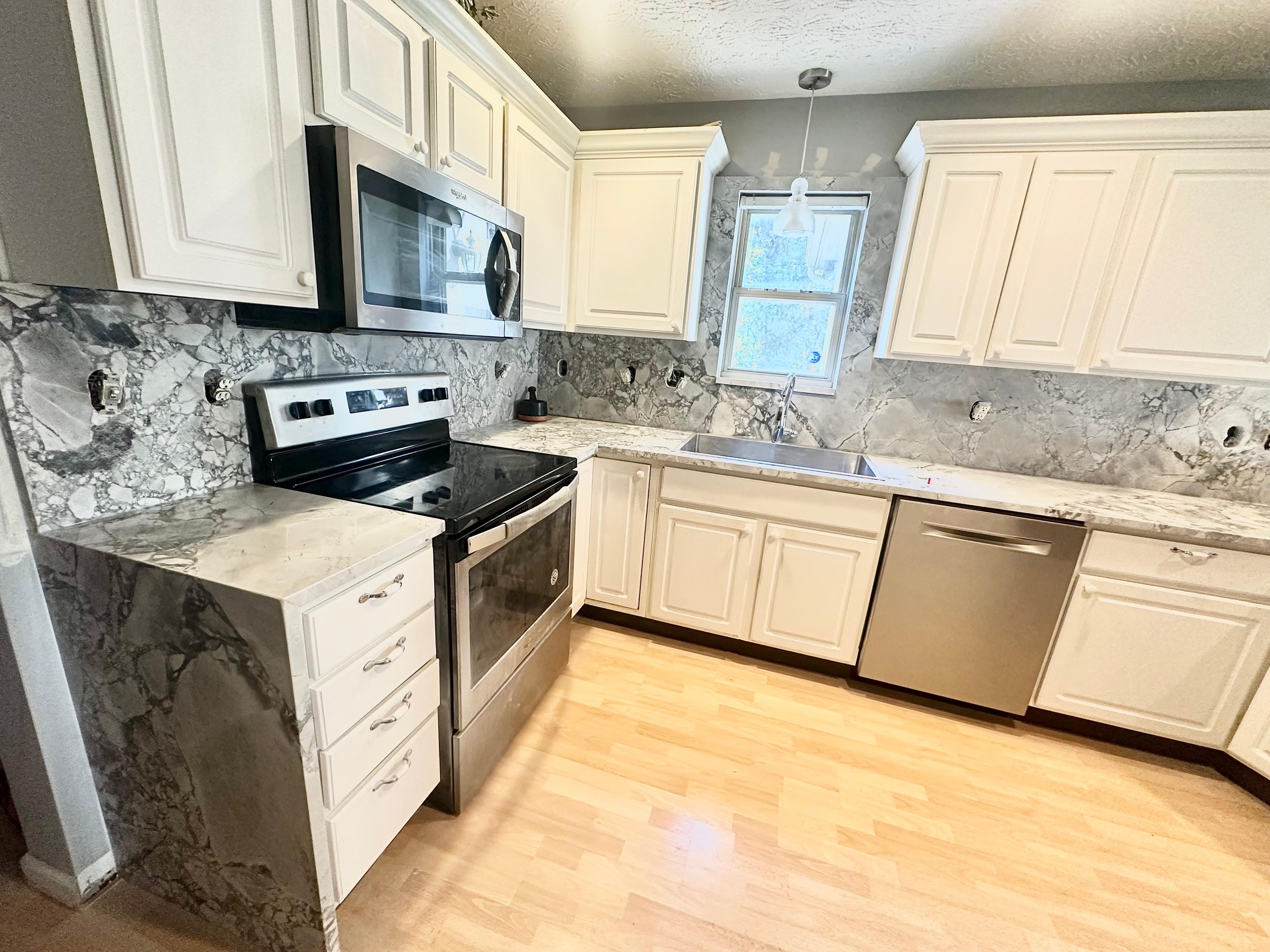 Luxury kitchen with island and marble countertop